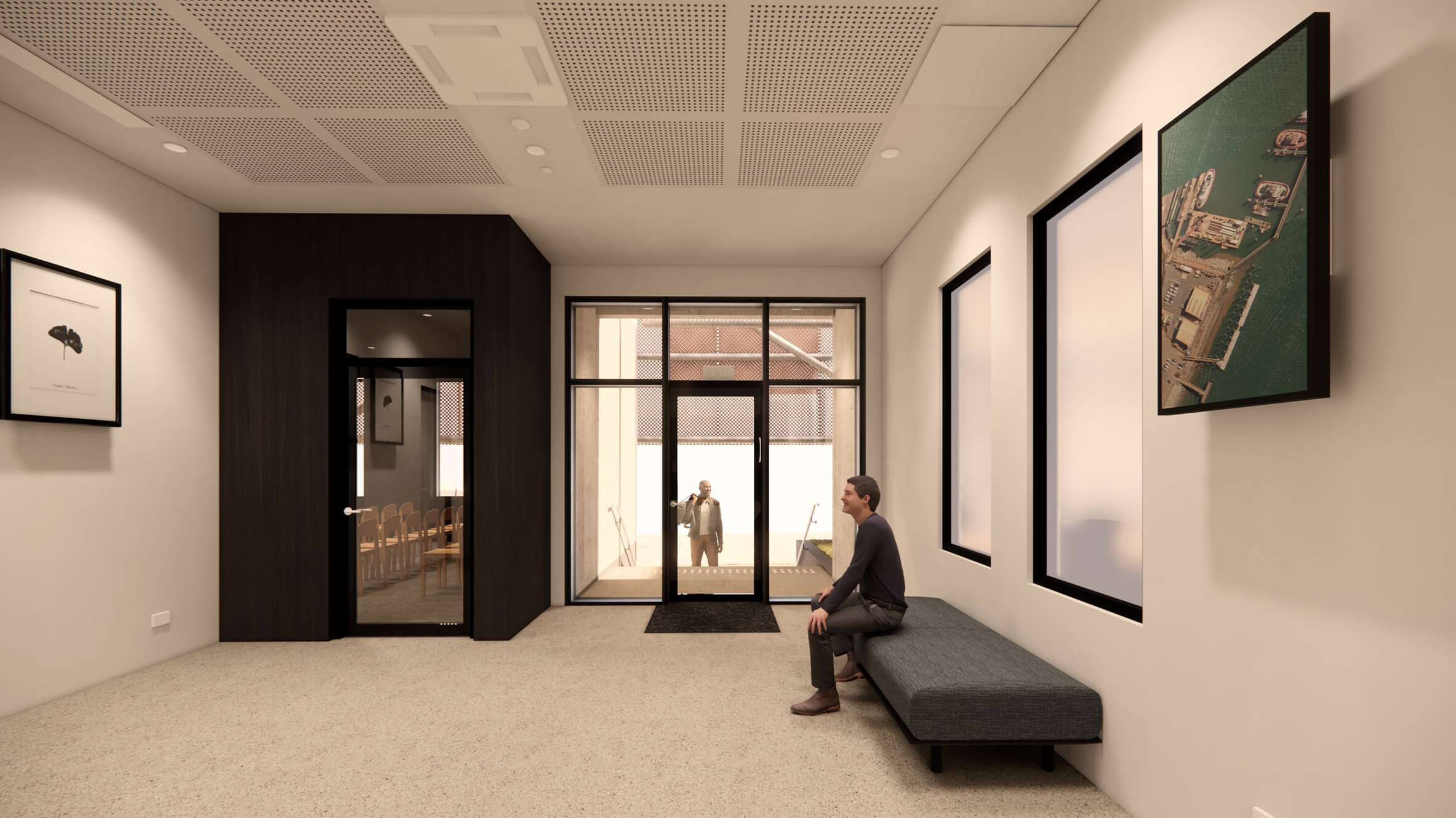 Modern reception area with a man sitting on a bench and another man visible outside through glass doors.