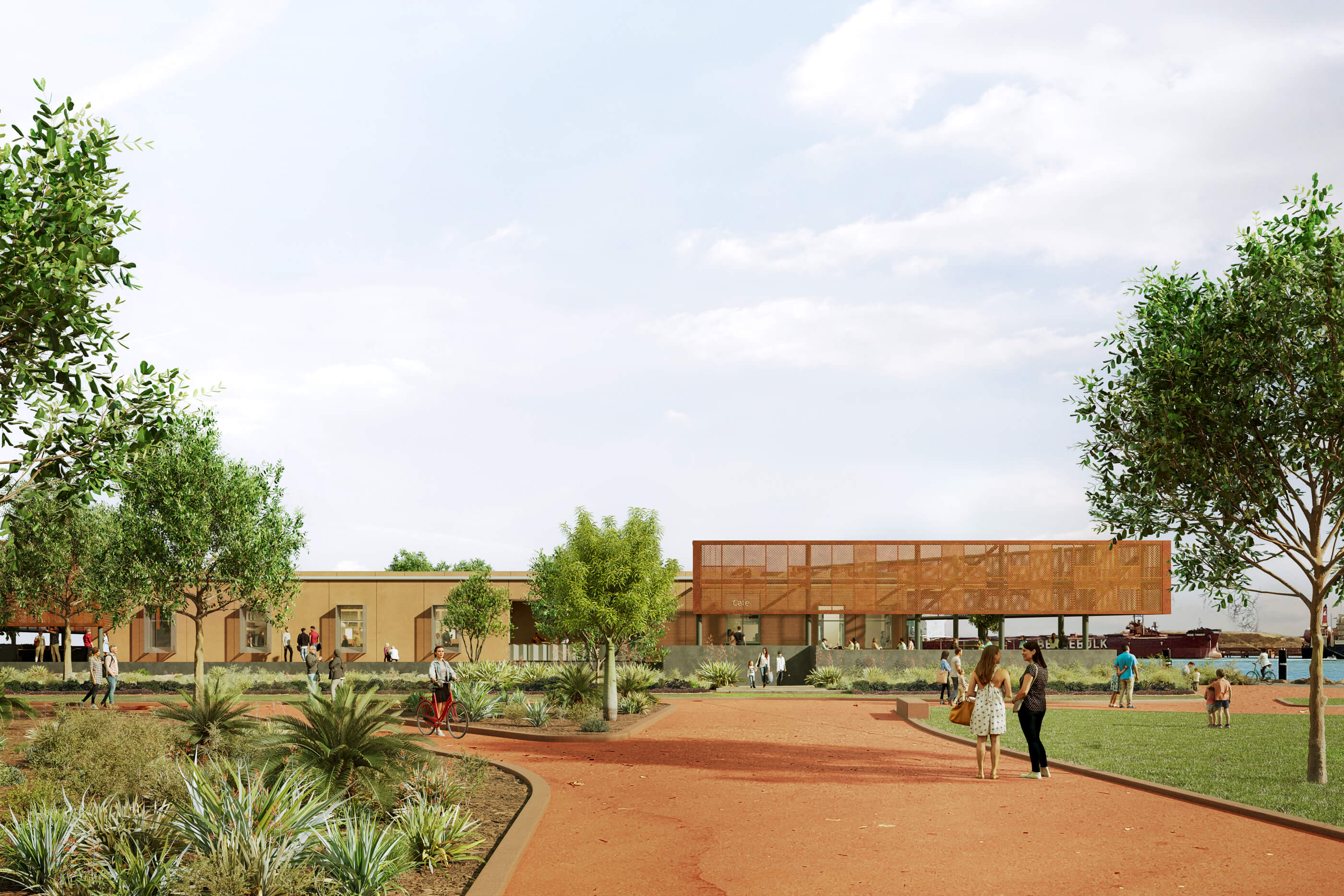 Modern park with landscaped trees and plants, people walking and biking near a building with a café overlooking a waterfront where a ship is docked.